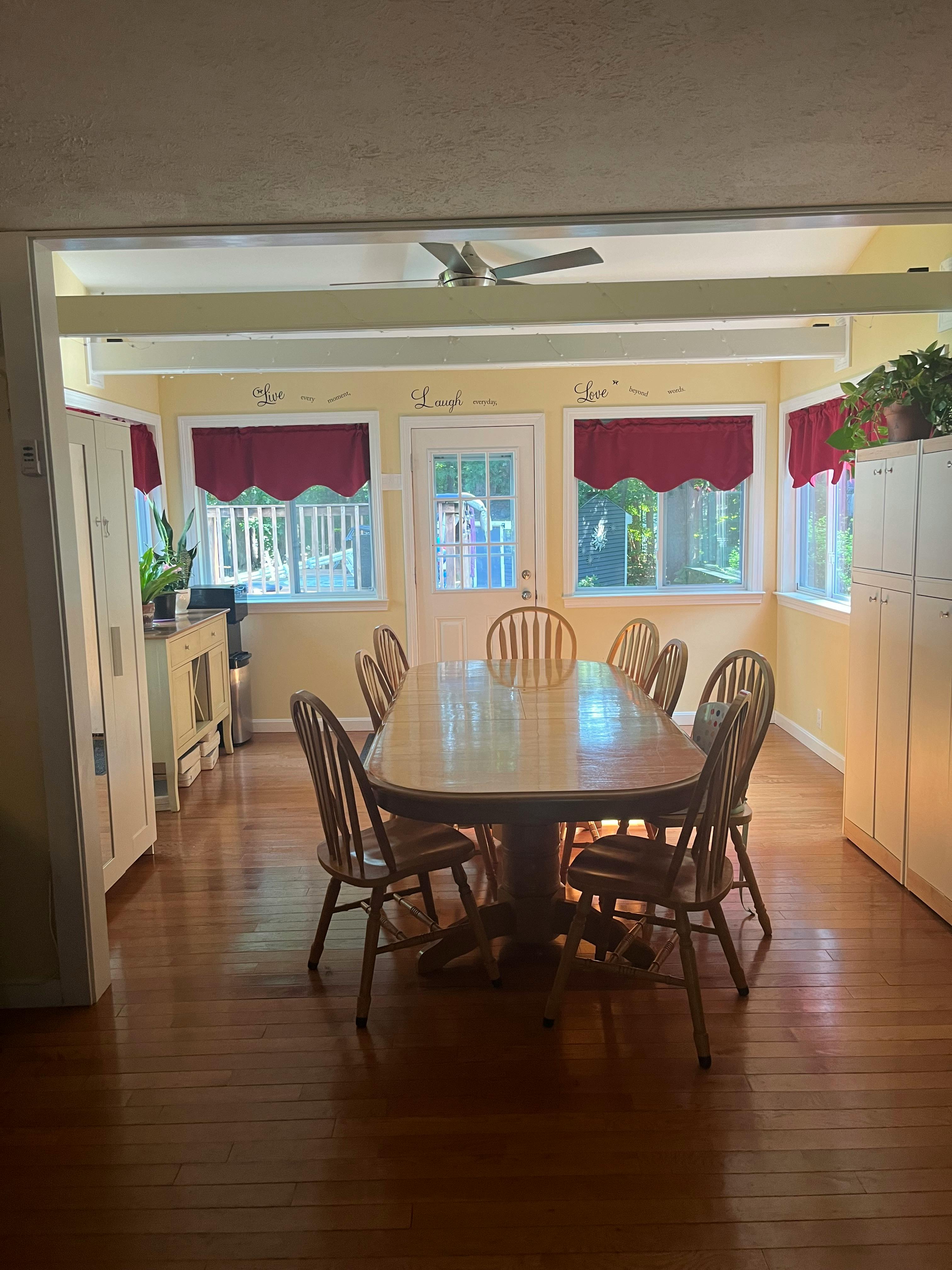 Dining room with a large wooden table and chairs