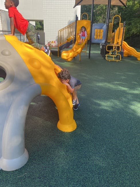 Children playing on a playground structure