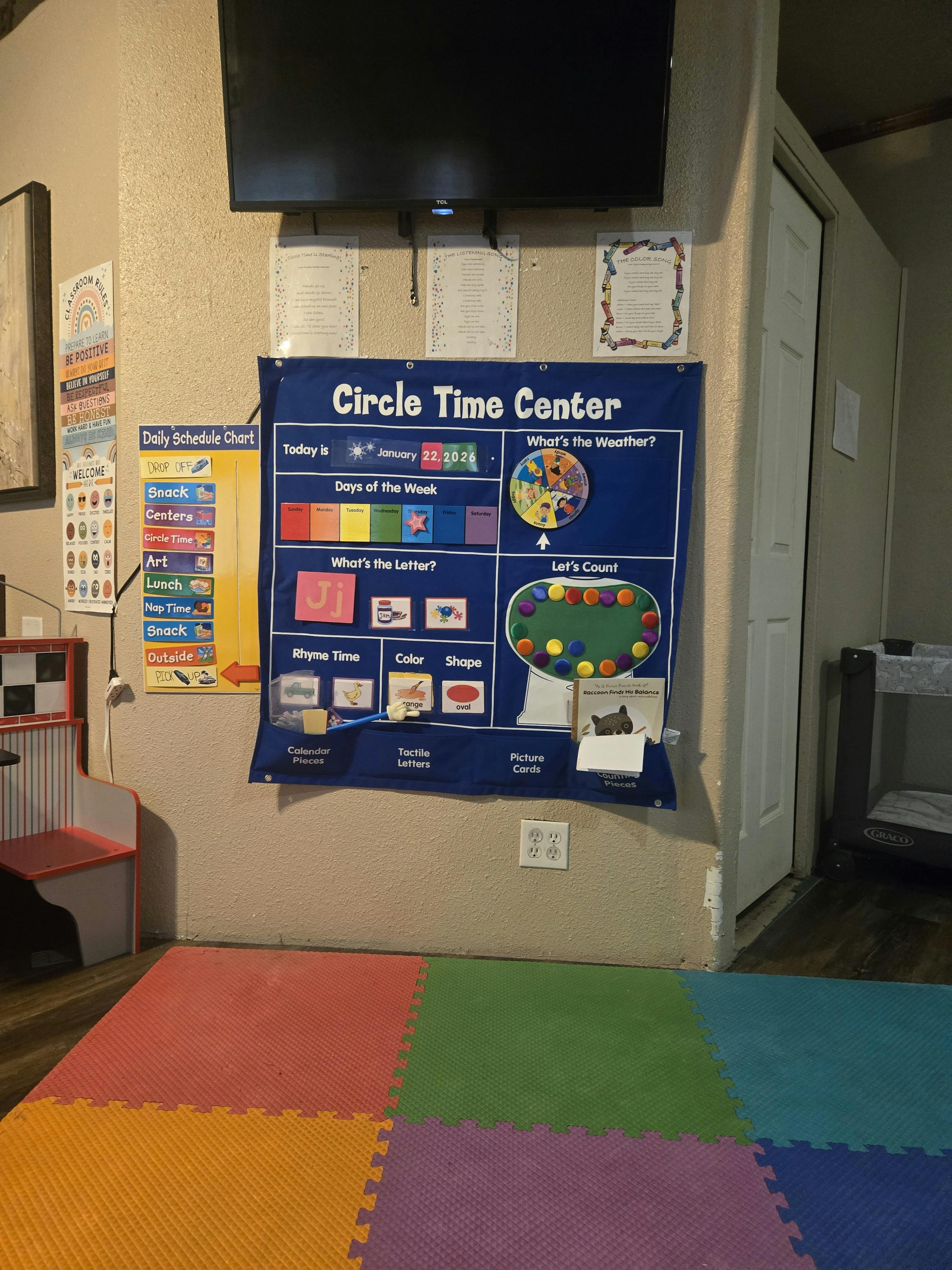 A classroom area with a 'Circle Time Center' calendar and schedule chart