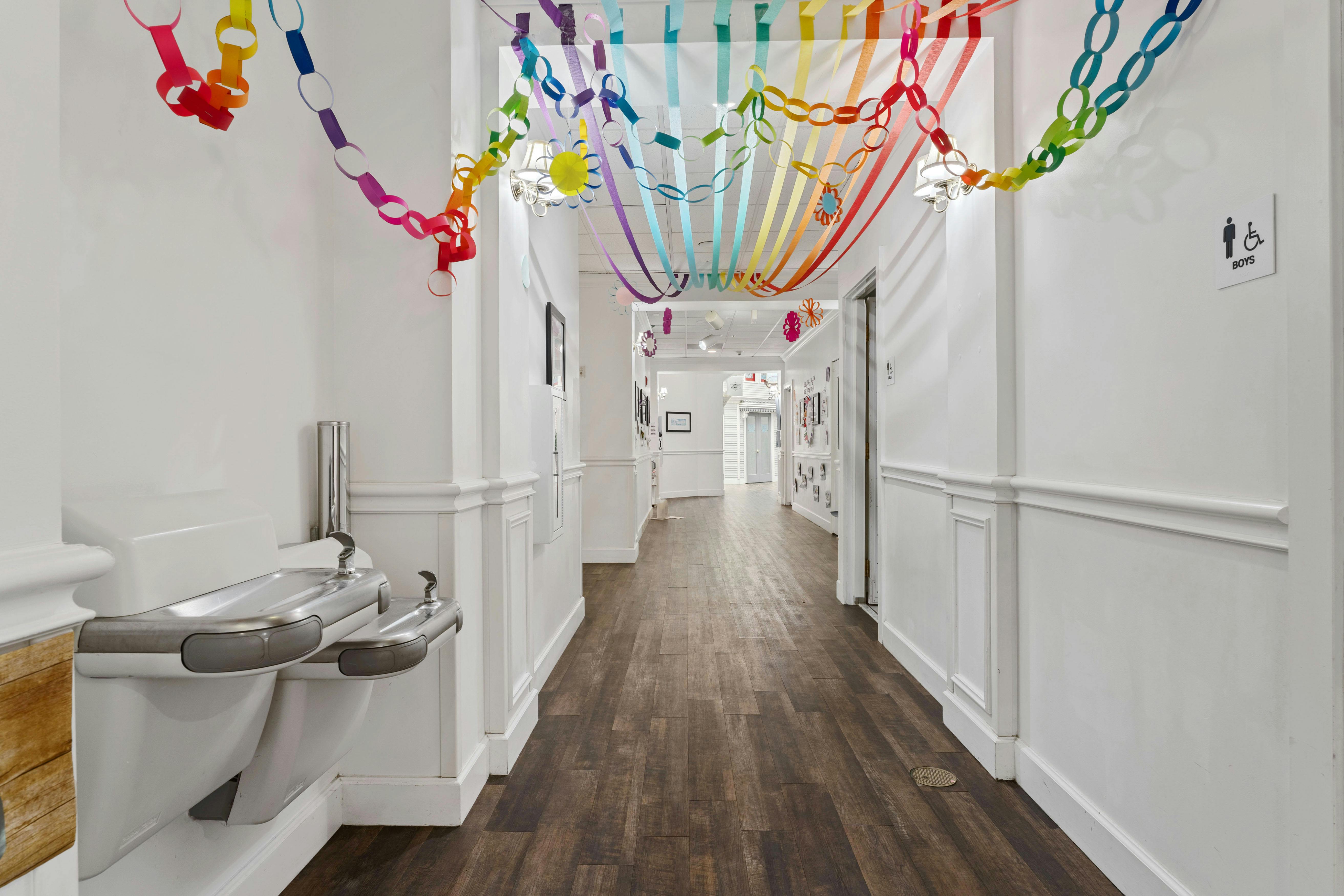 Hallway decorated with colorful paper chains and streamers