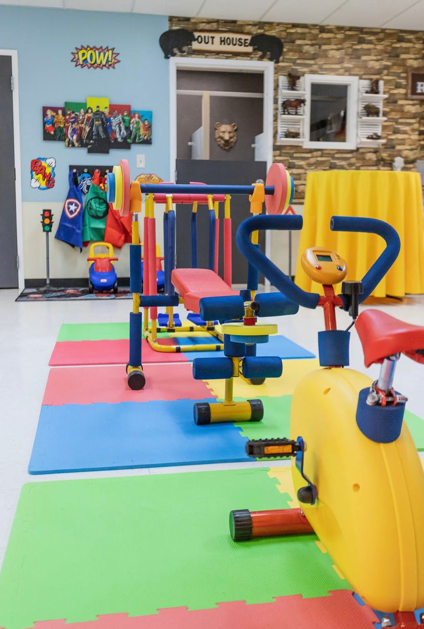 Children's exercise equipment on colorful foam mats