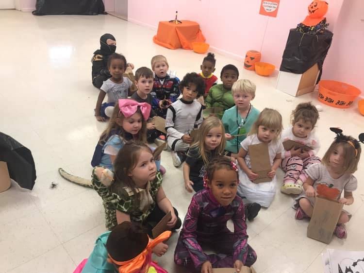 Group of children sitting on the floor