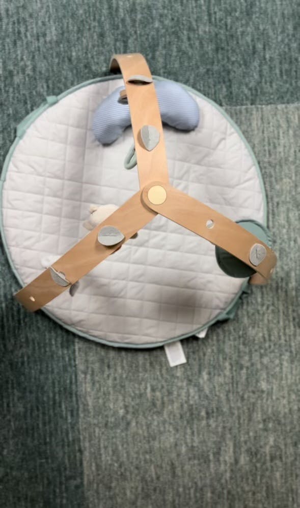 Baby play mat with wooden activity arch