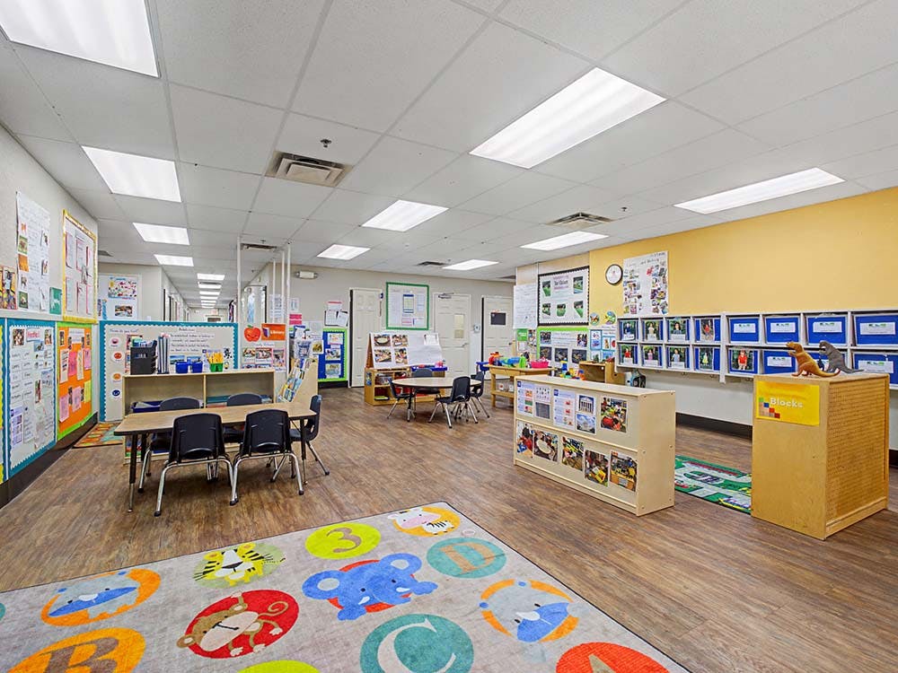 Colorful and organized classroom with tables and chairs