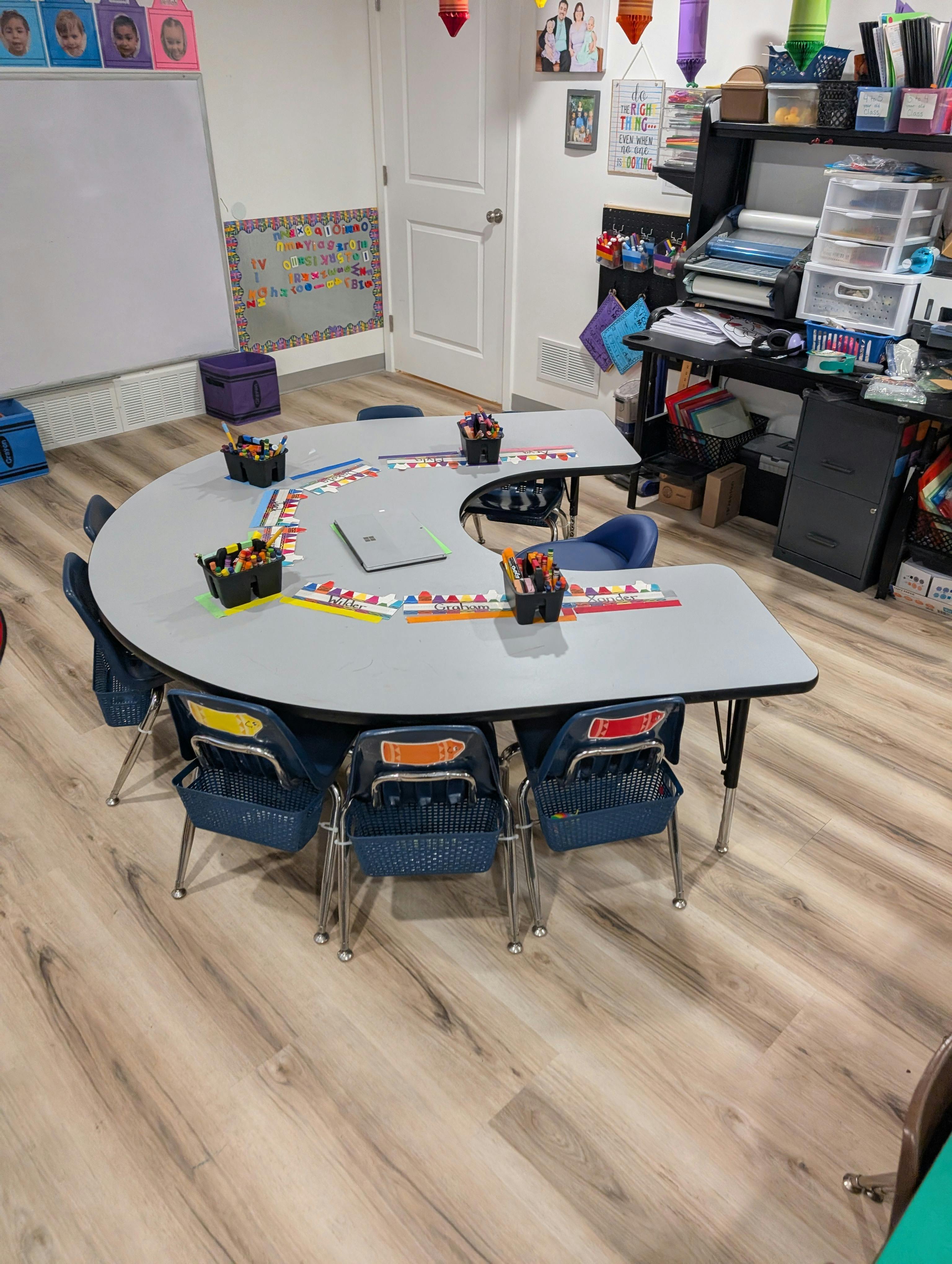 Classroom with a U-shaped table and chairs