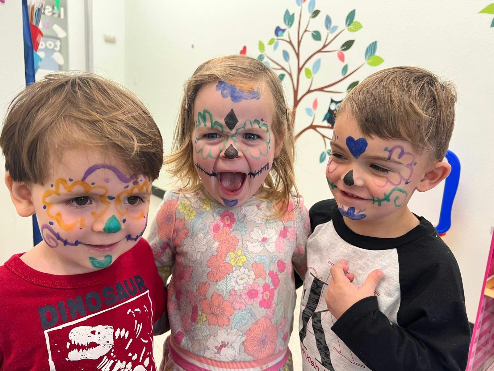 Three children with painted faces
