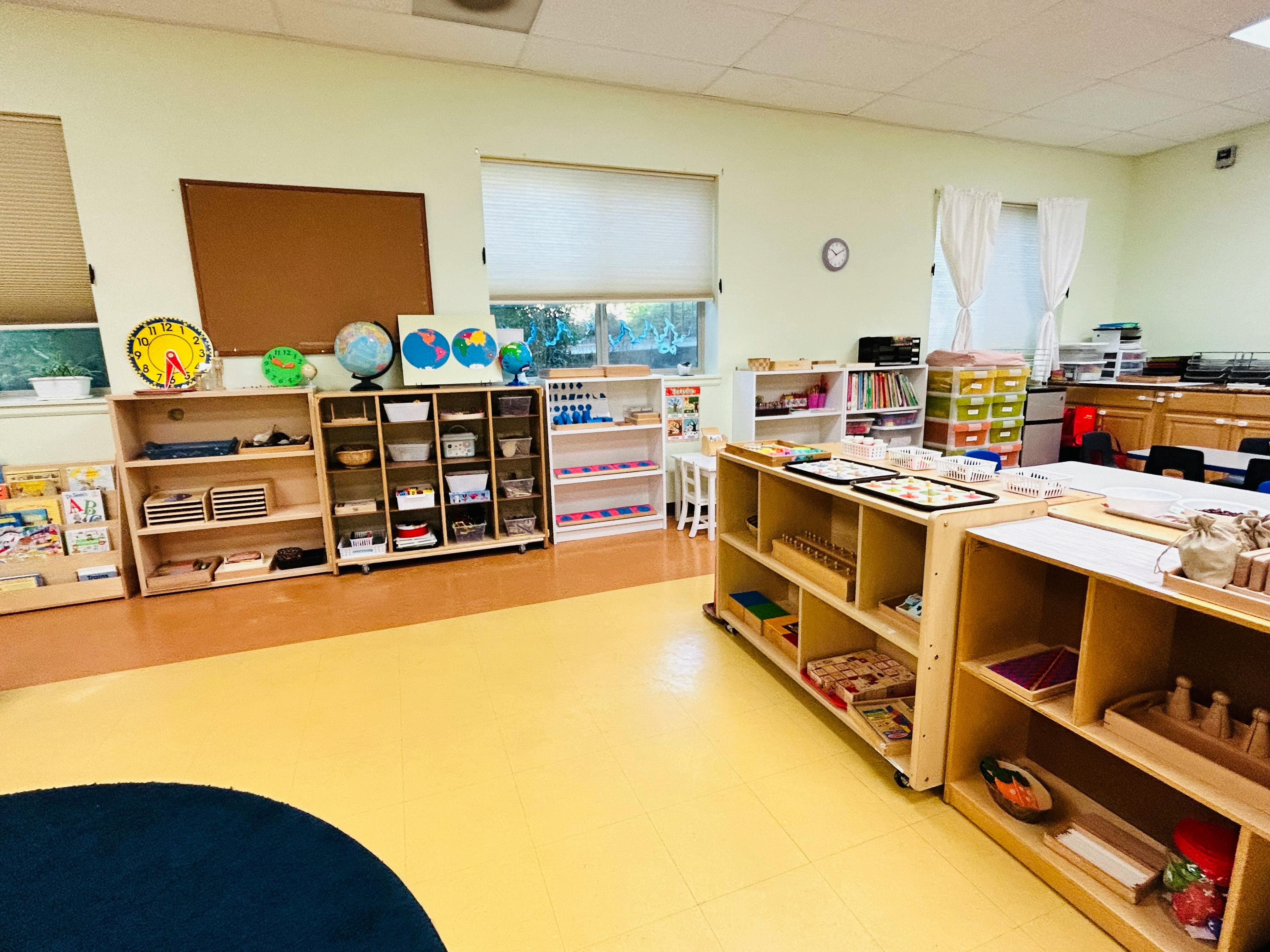 Classroom with shelves of learning materials and globes