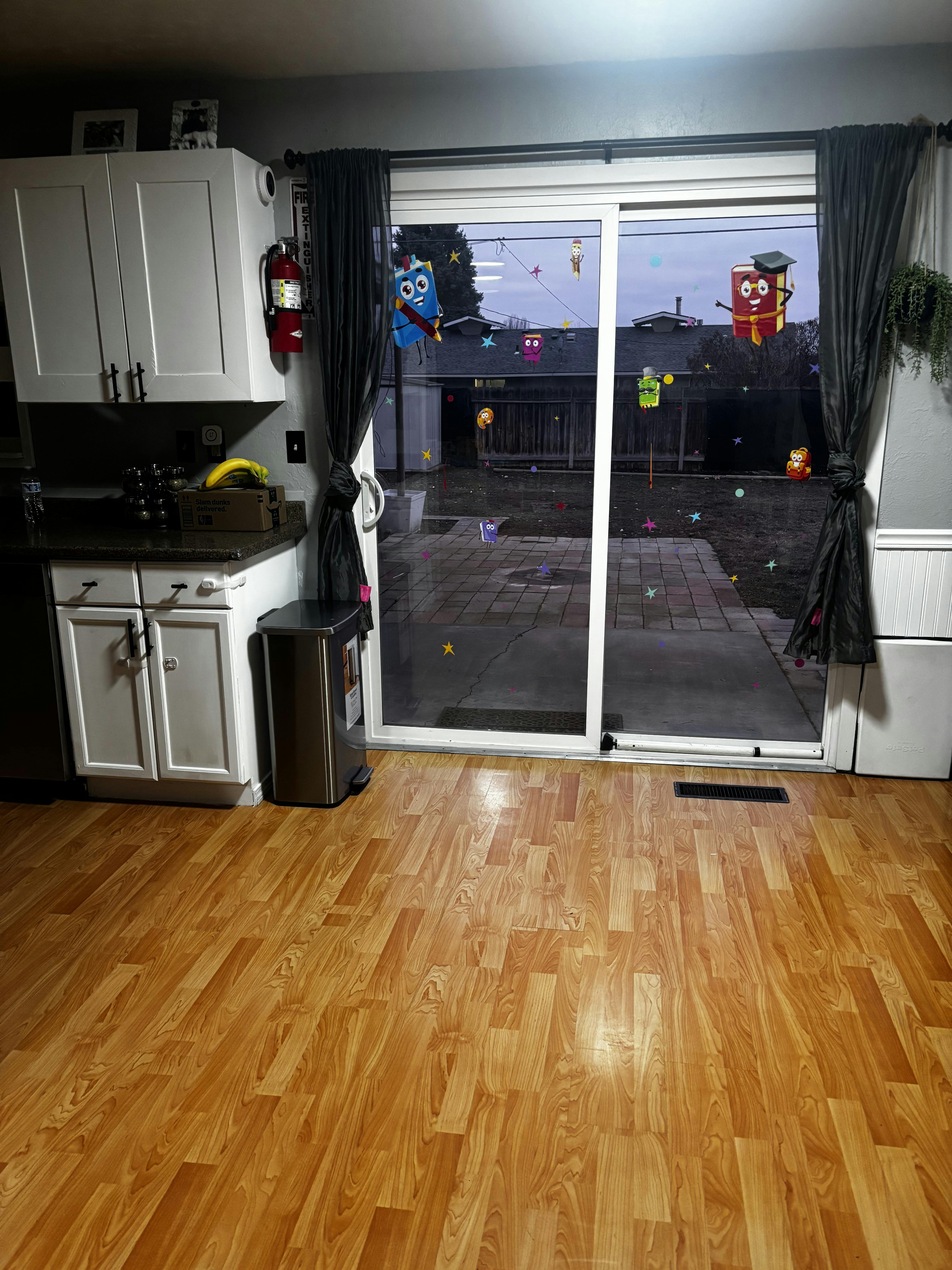 Kitchen interior with sliding glass door decorated with colorful cutouts