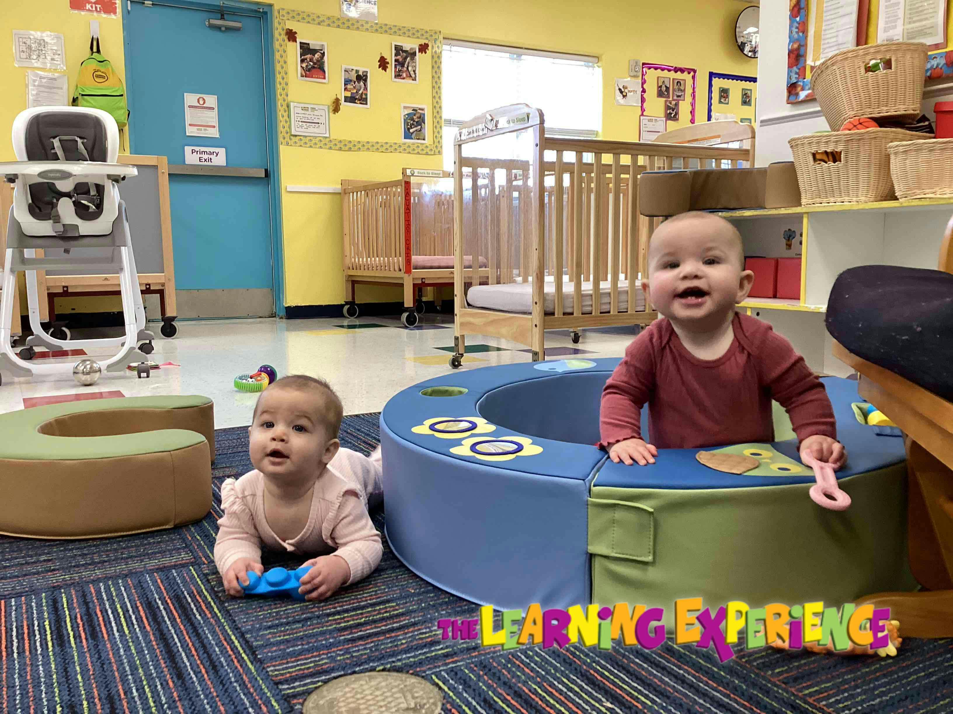 Two children playing in a classroom