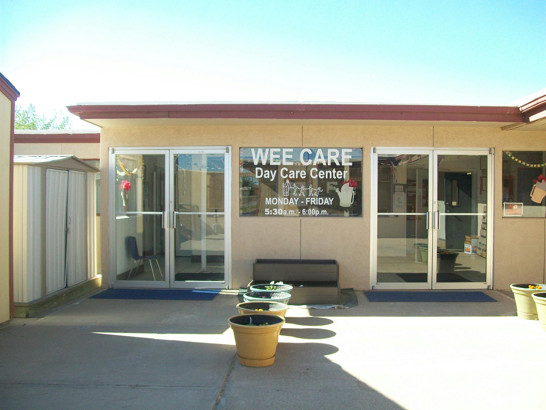 Wee Care Day Care Center sign on building exterior