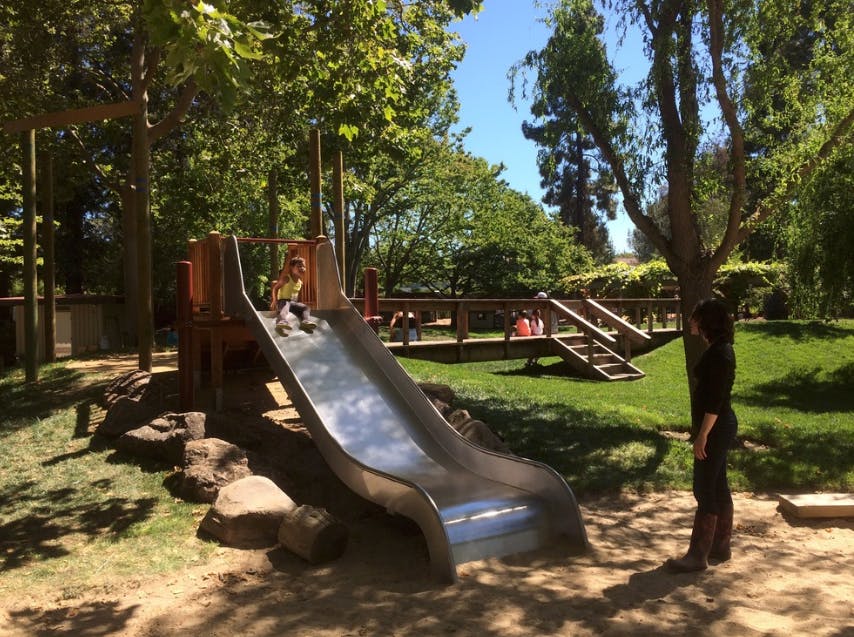 Child on a slide in a playground