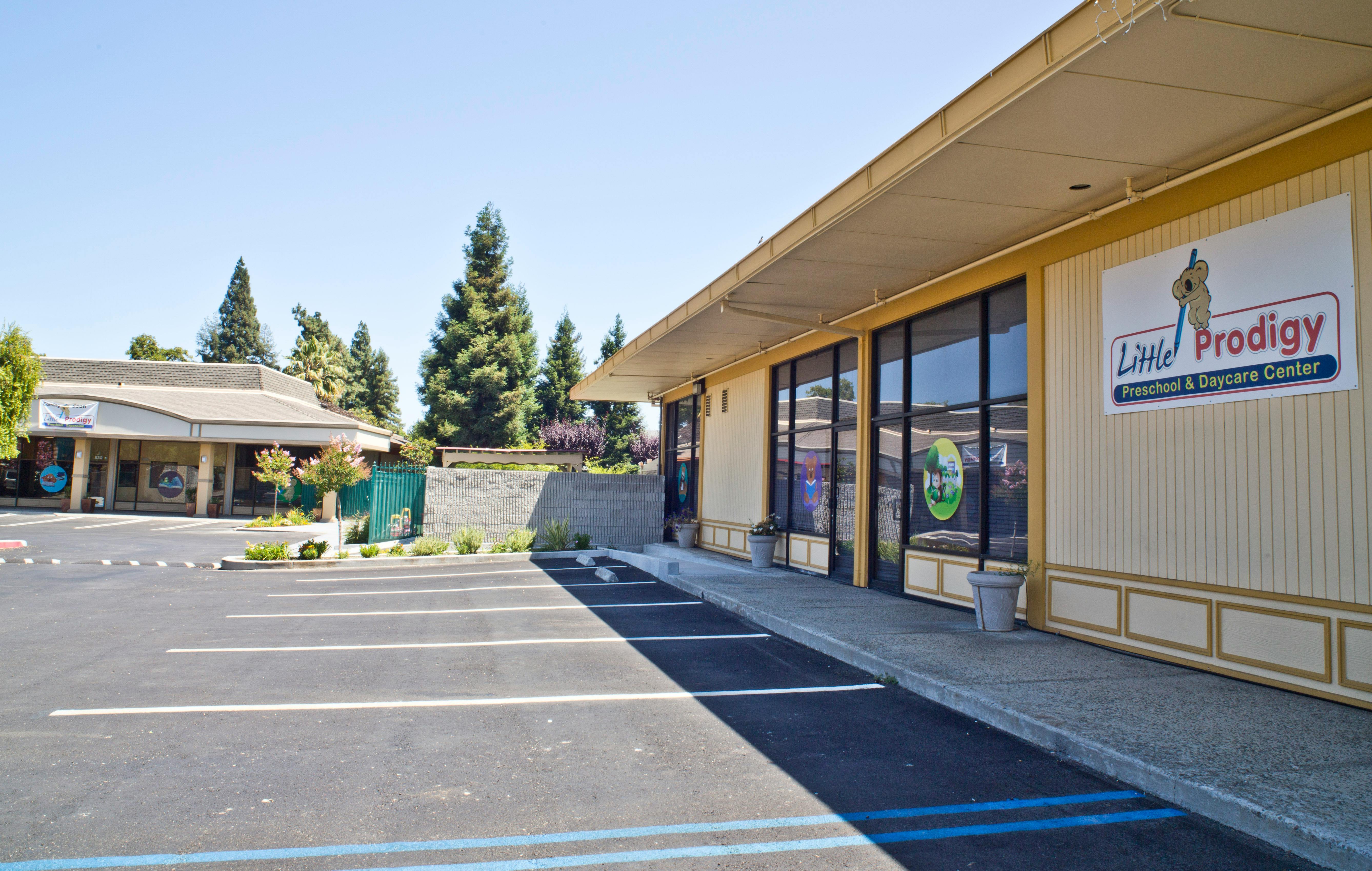 Exterior of a building with a sign that reads "Little Prodigy Preschool & Daycare Center"