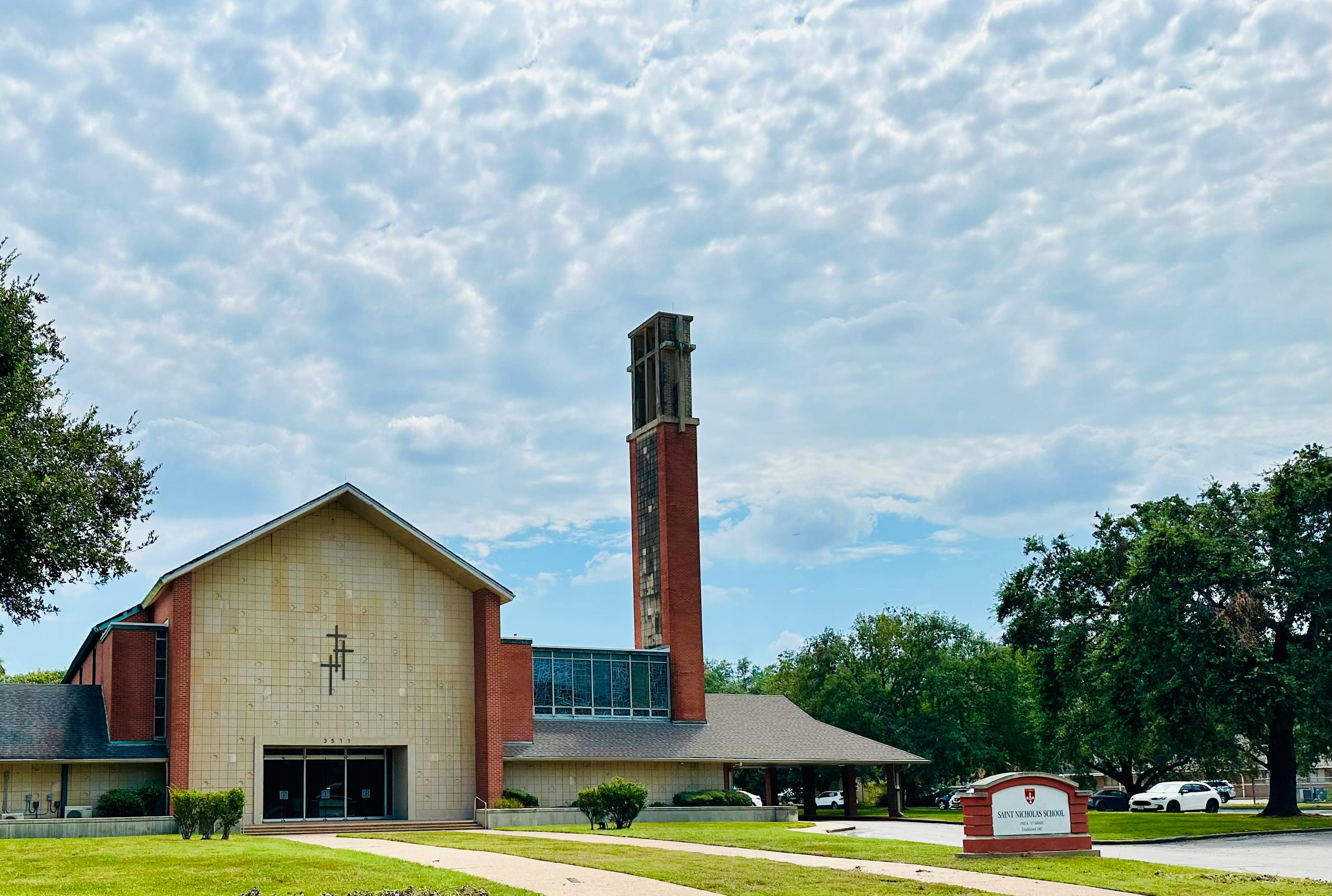 Church building with a tall brick bell tower