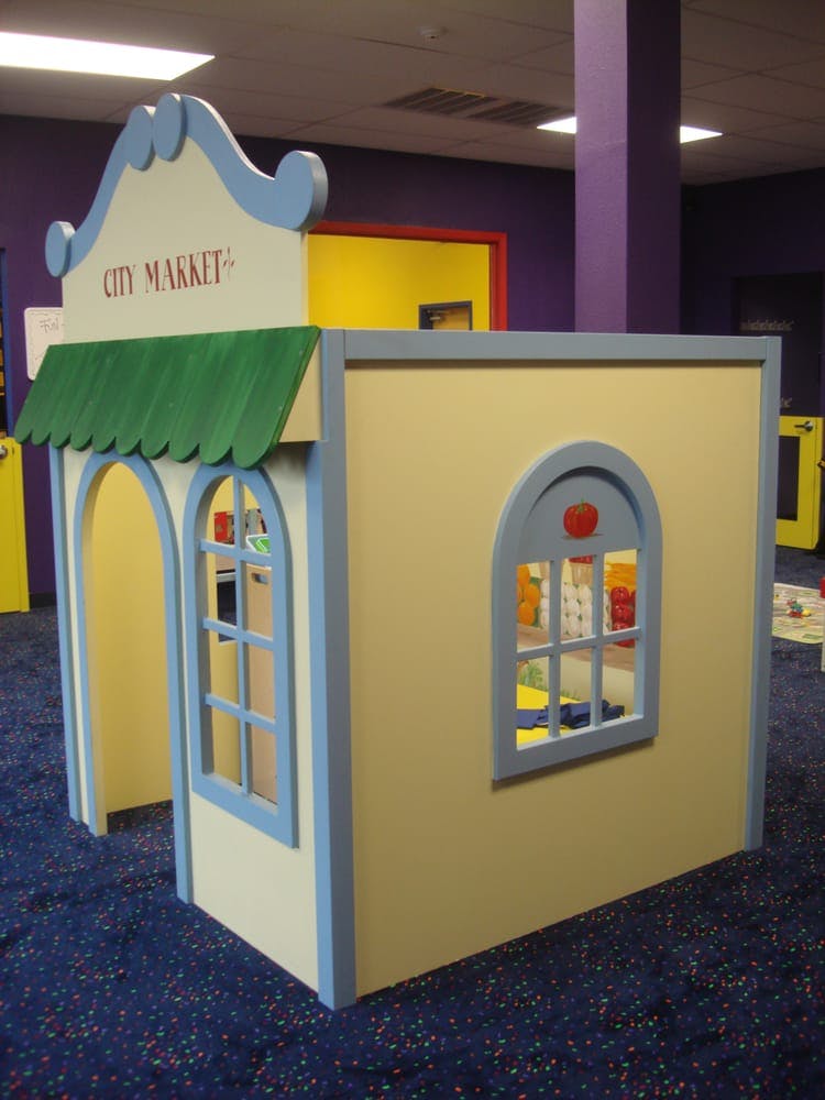 Playhouse with "City Market" sign
