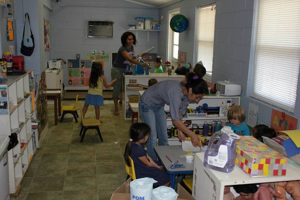 Adults and children in a classroom