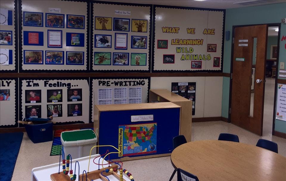 Classroom with children's artwork and educational posters on the walls