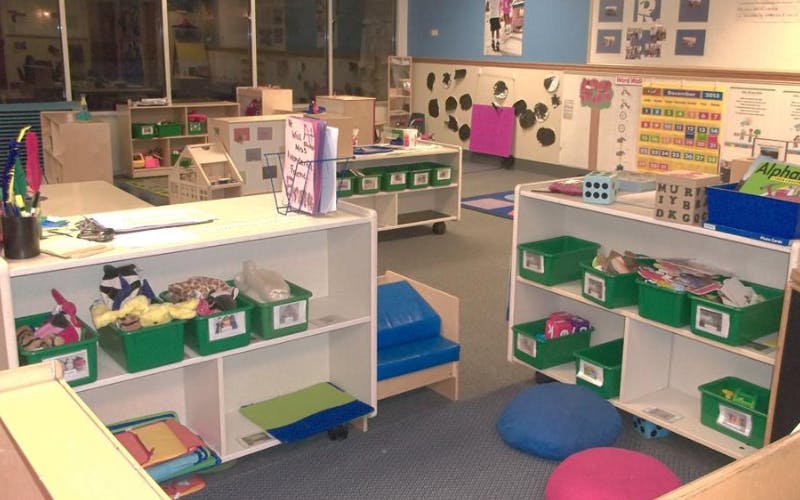 Classroom filled with shelves of toys and learning materials
