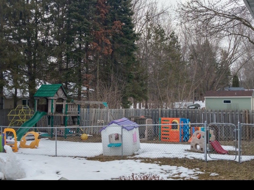 Playground with snow on the ground and various play structures