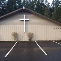 Church building with a white cross on the front