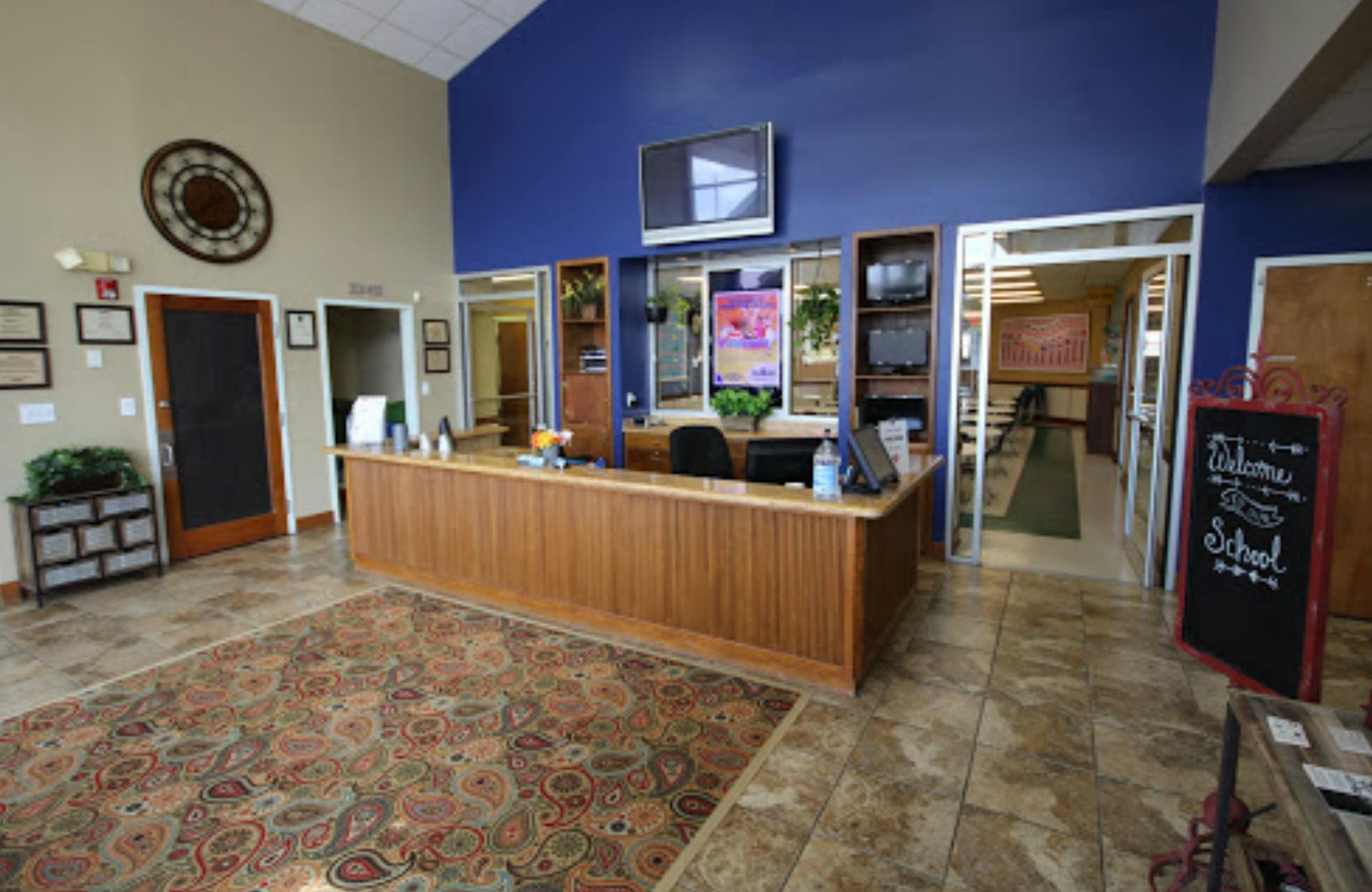 Reception desk in a room with blue and beige walls