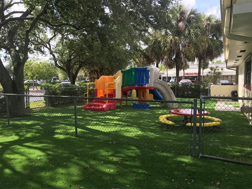 Playground with colorful play structure on artificial grass