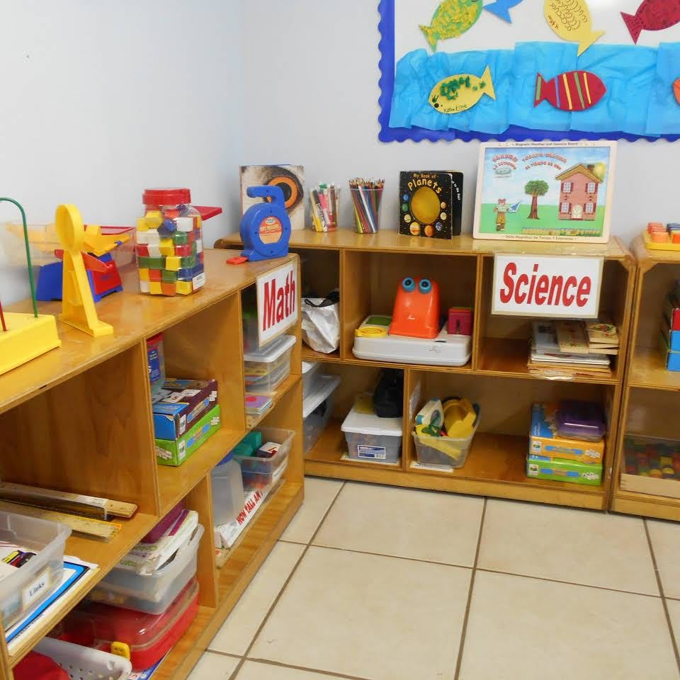 Classroom with shelves of learning materials and signs for Math and Science