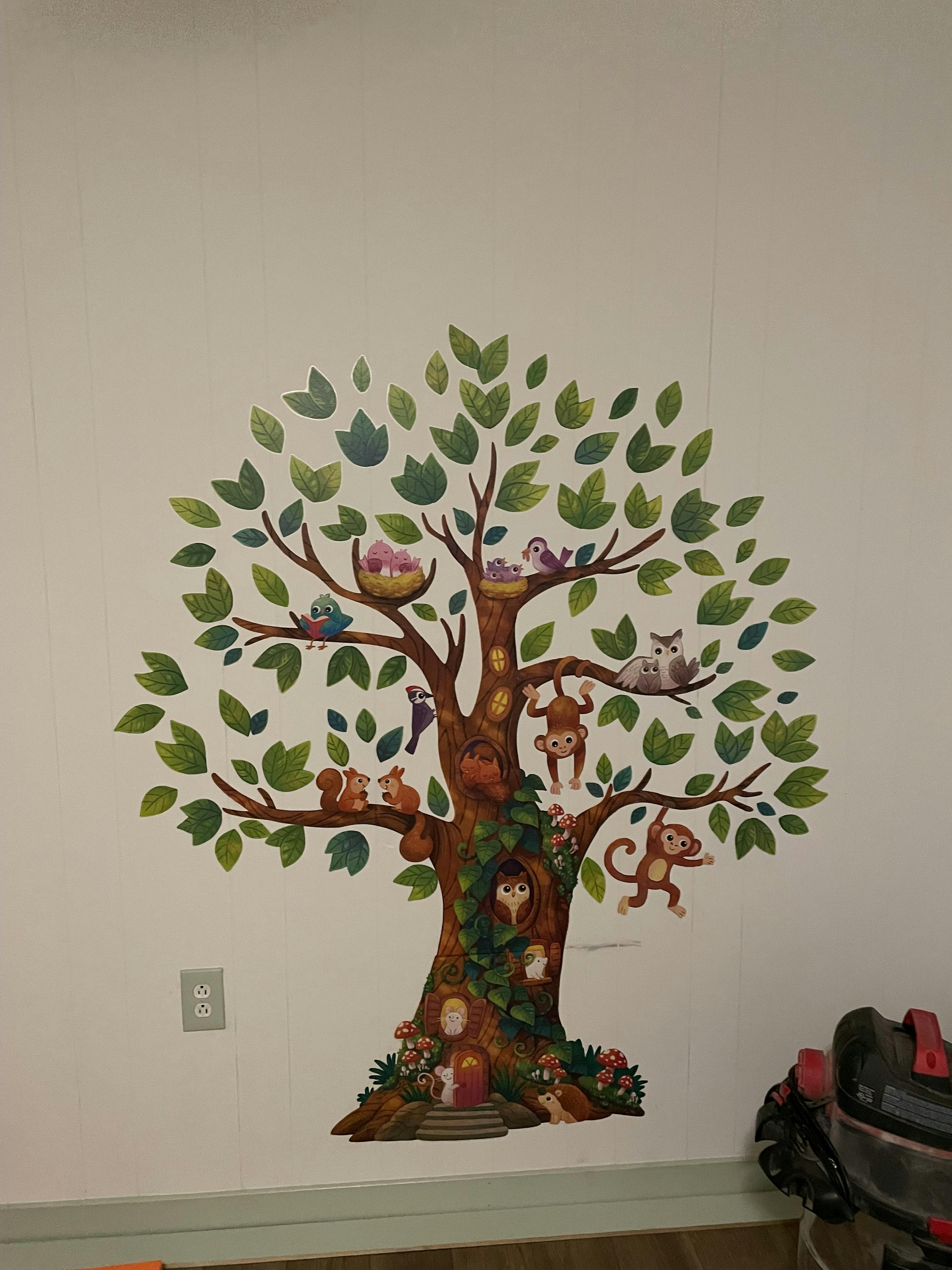 Tree wall decal with various animals including birds, squirrels, monkeys, and an owl