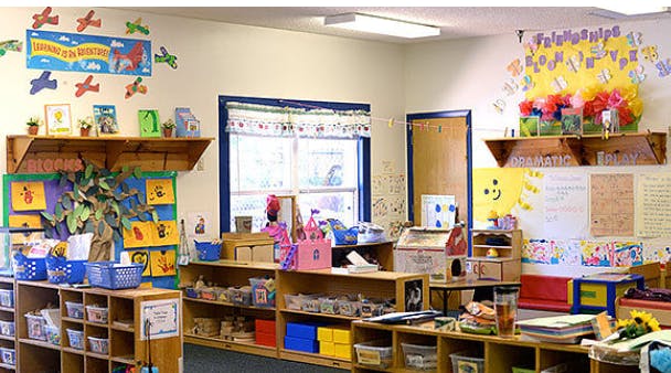 Classroom with shelves, window, and decorations