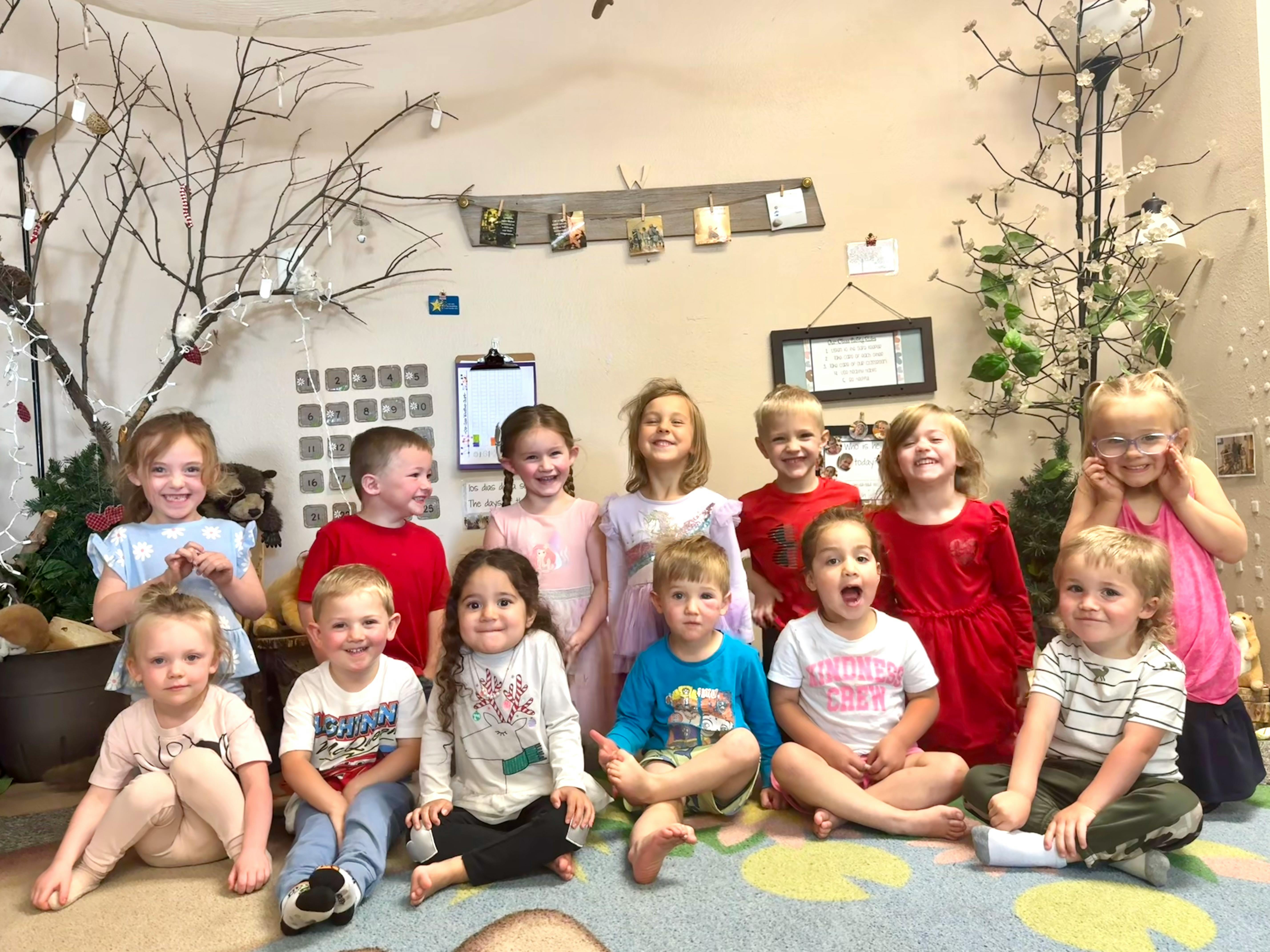 Group of children sitting and standing in a room
