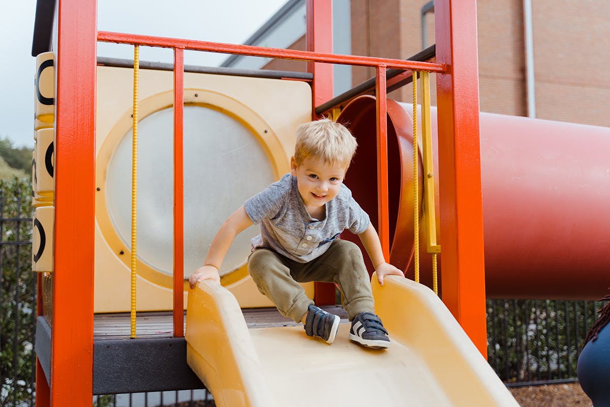 Child on a playground slide