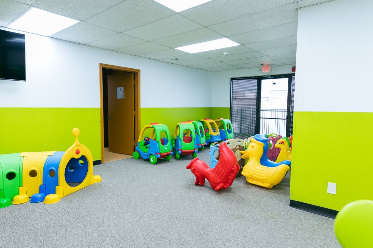 Colorful plastic play equipment for children in an indoor room