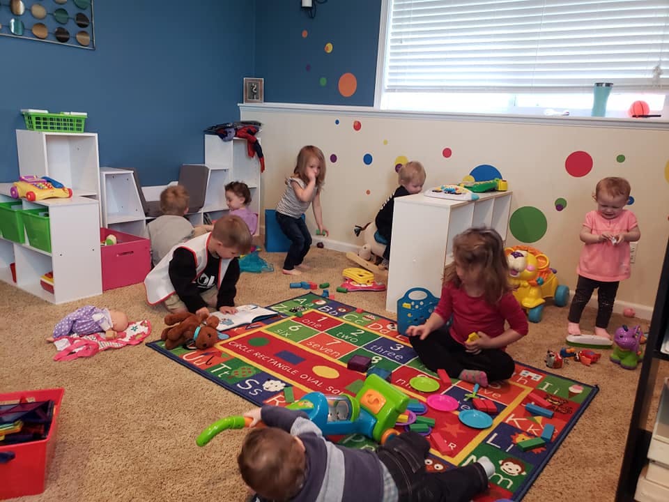 Children playing with toys in a classroom