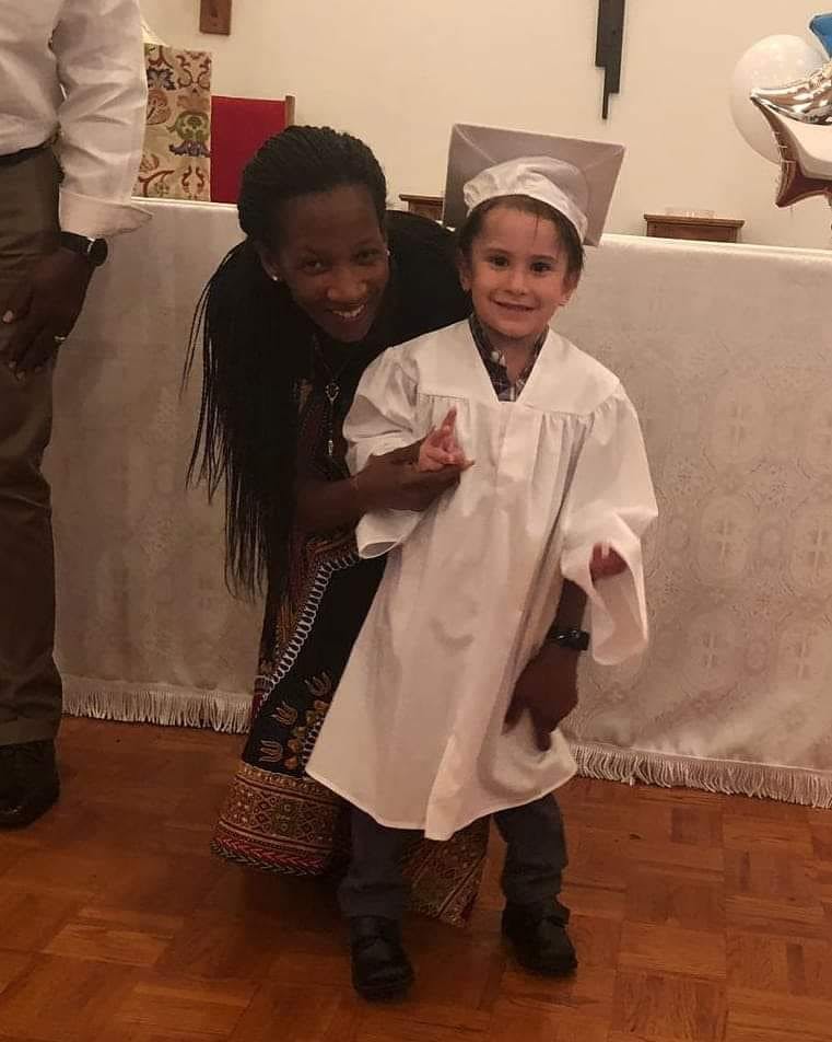 Person and child in graduation cap and gown
