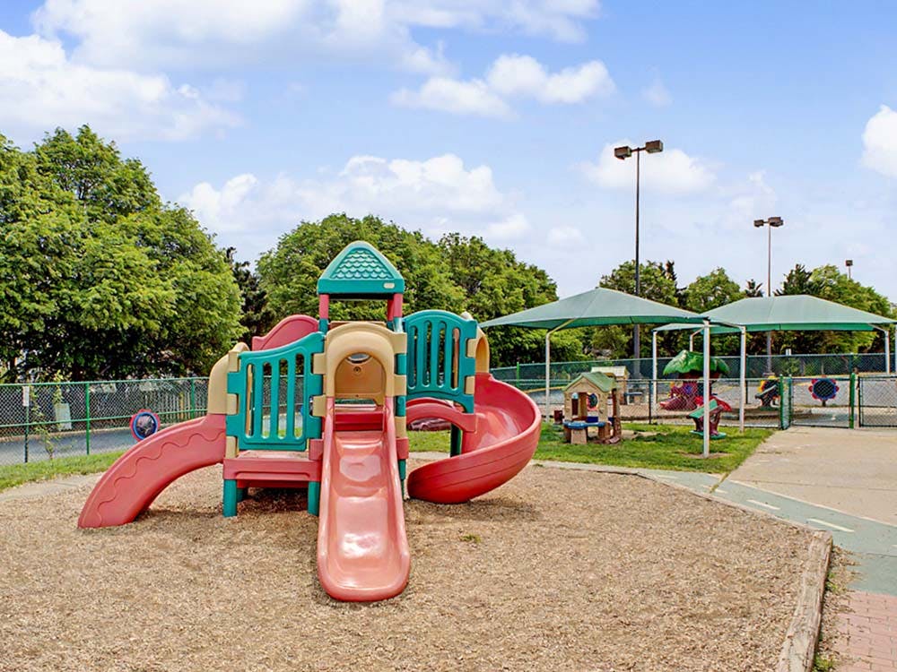 Playground with slides and shaded areas