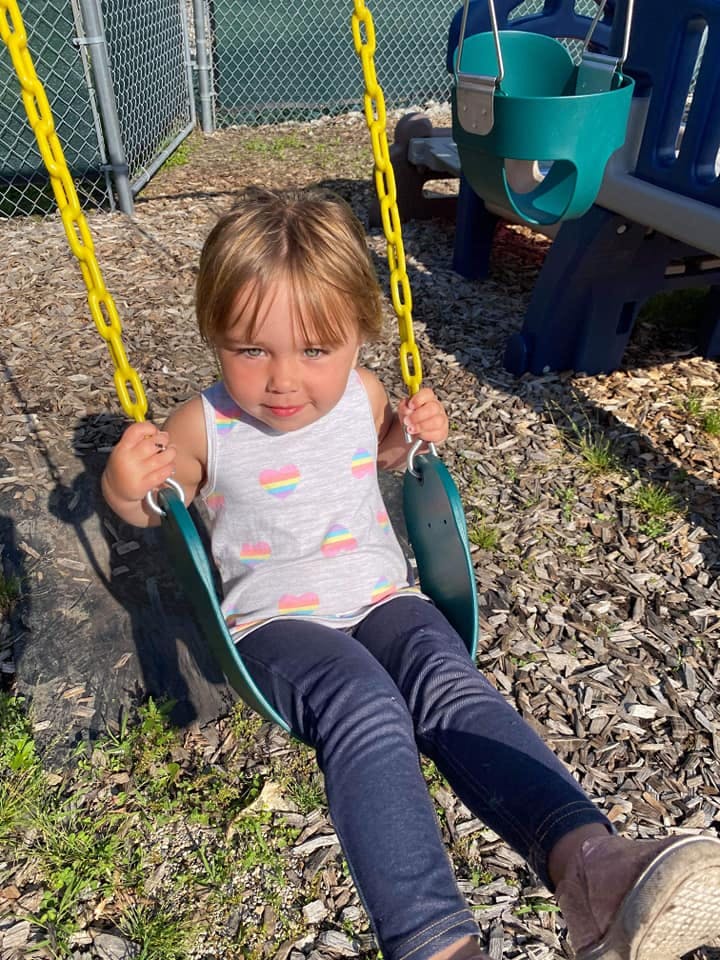 Child on a swing at a playground