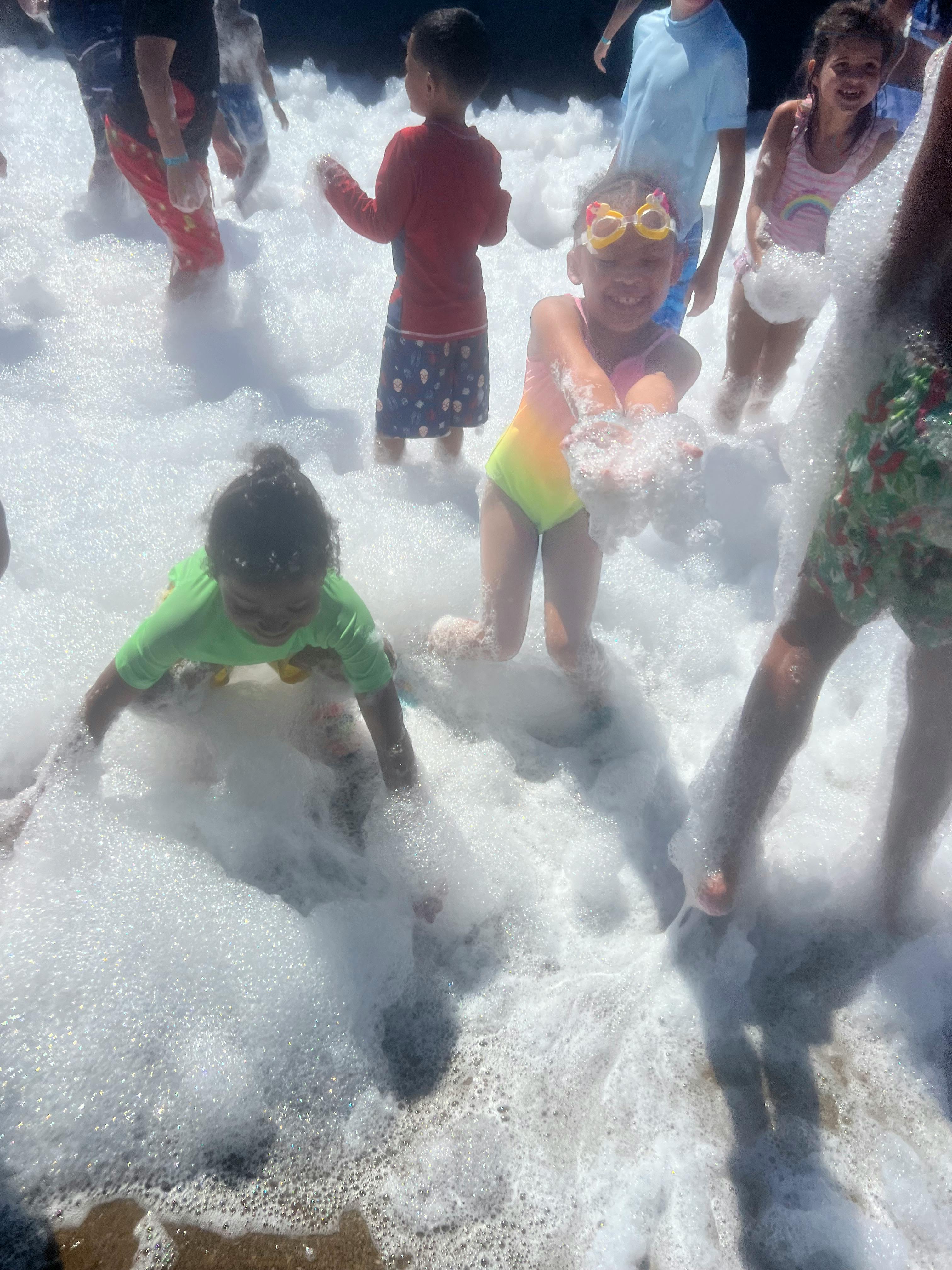 Children playing in foam