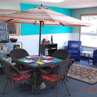 Outdoor dining table with umbrella and chairs