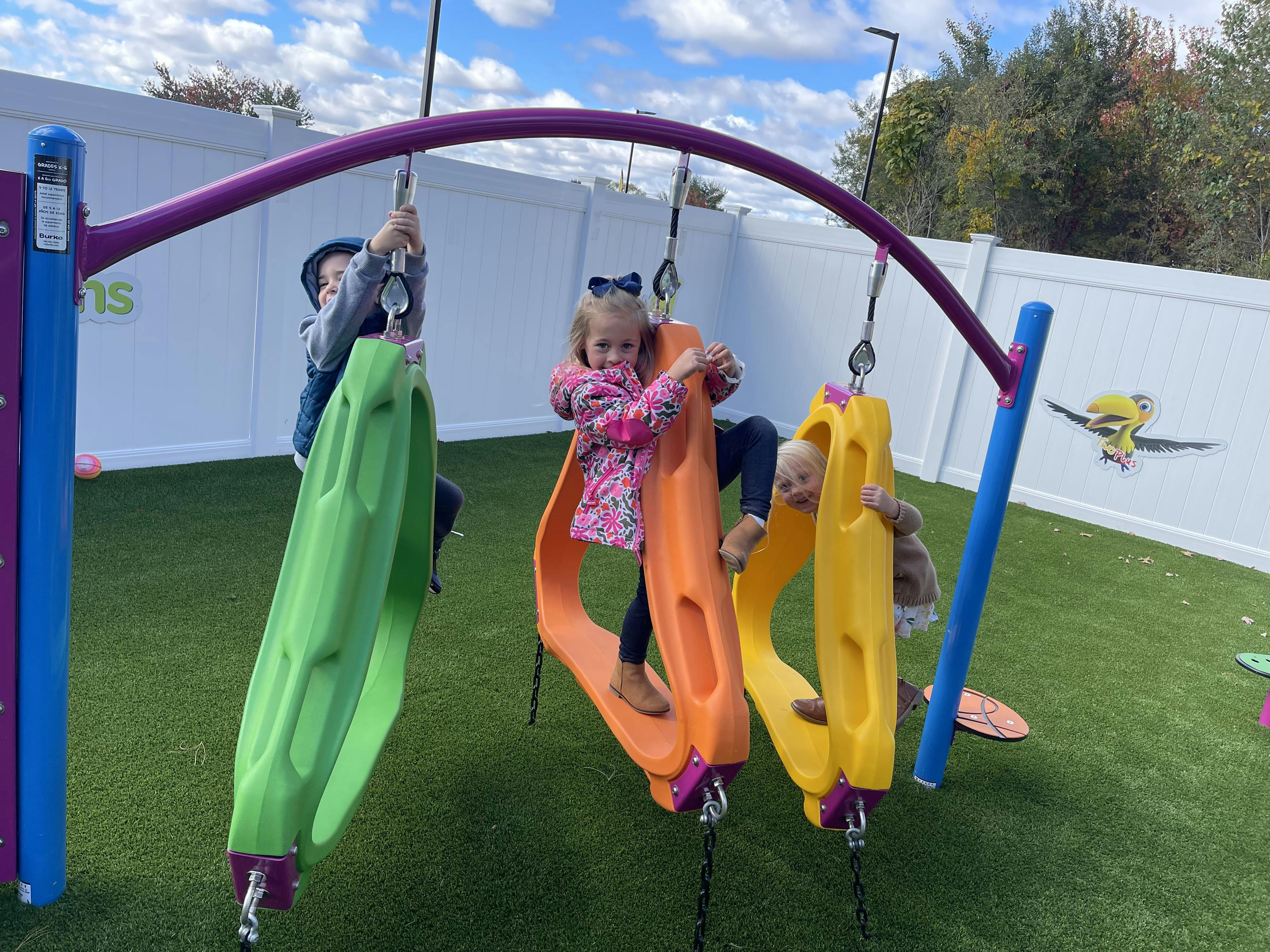 Children on swings on a playground