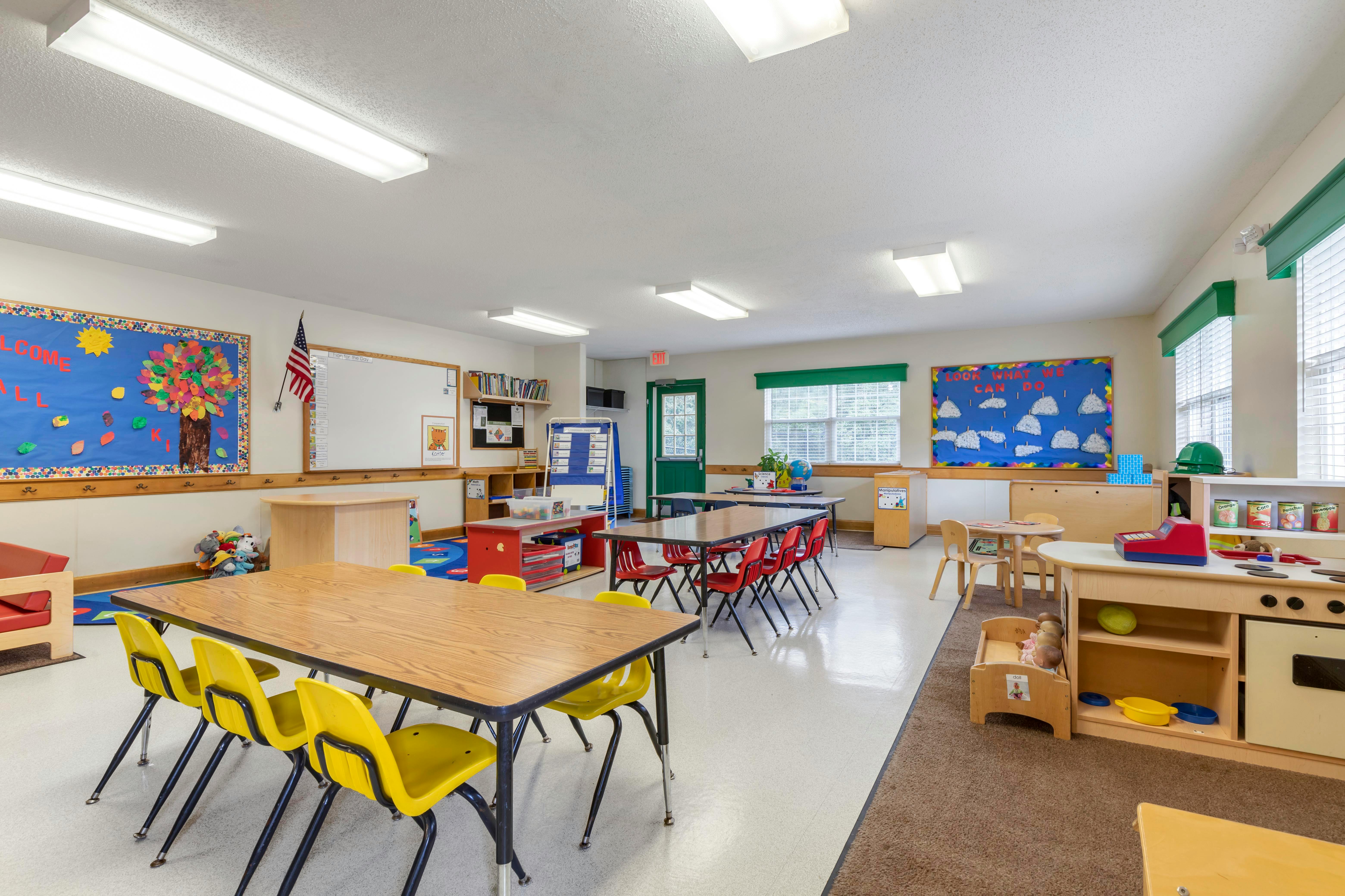 Colorful classroom with child-sized tables and chairs