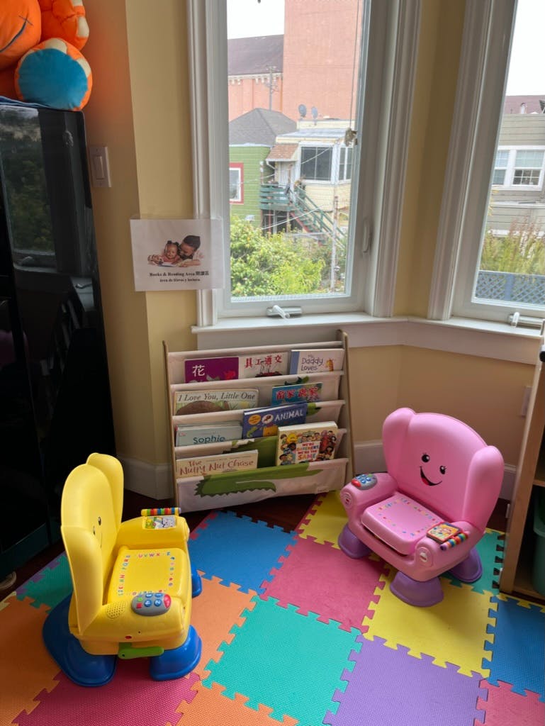Children's chairs and a bookshelf in a room with a window