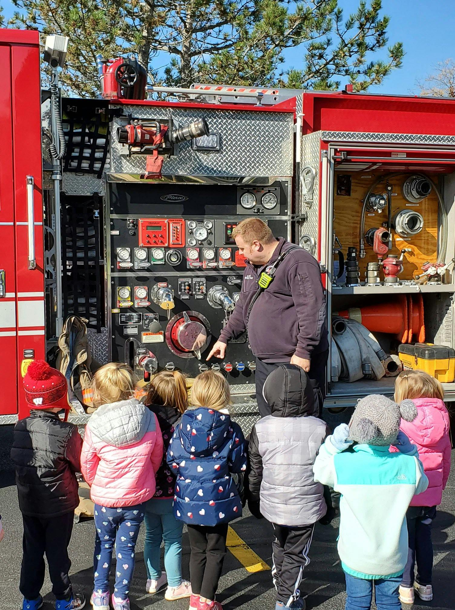 Person showing children controls on a fire truck