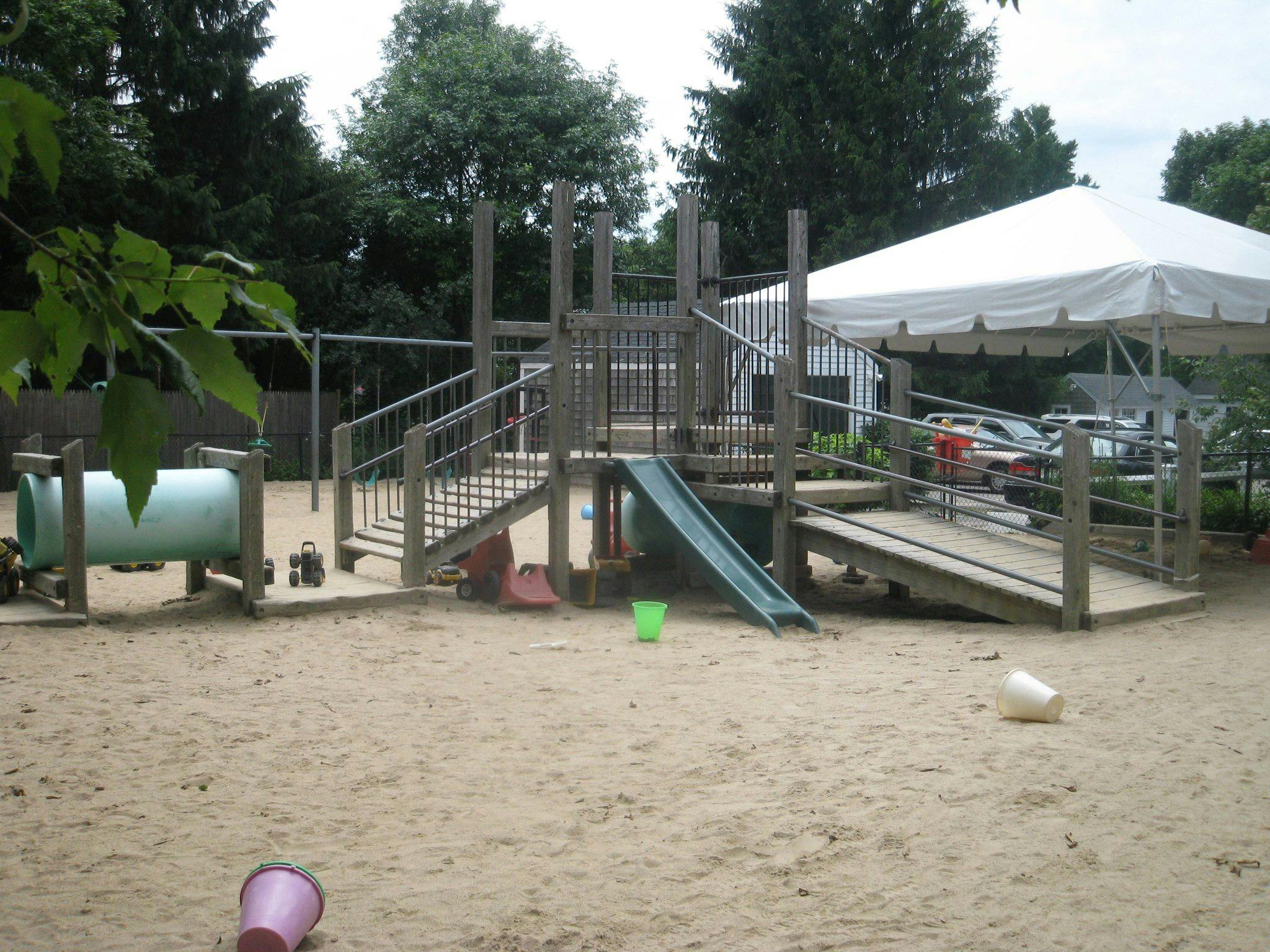 Playground with sand, slides, and climbing structures