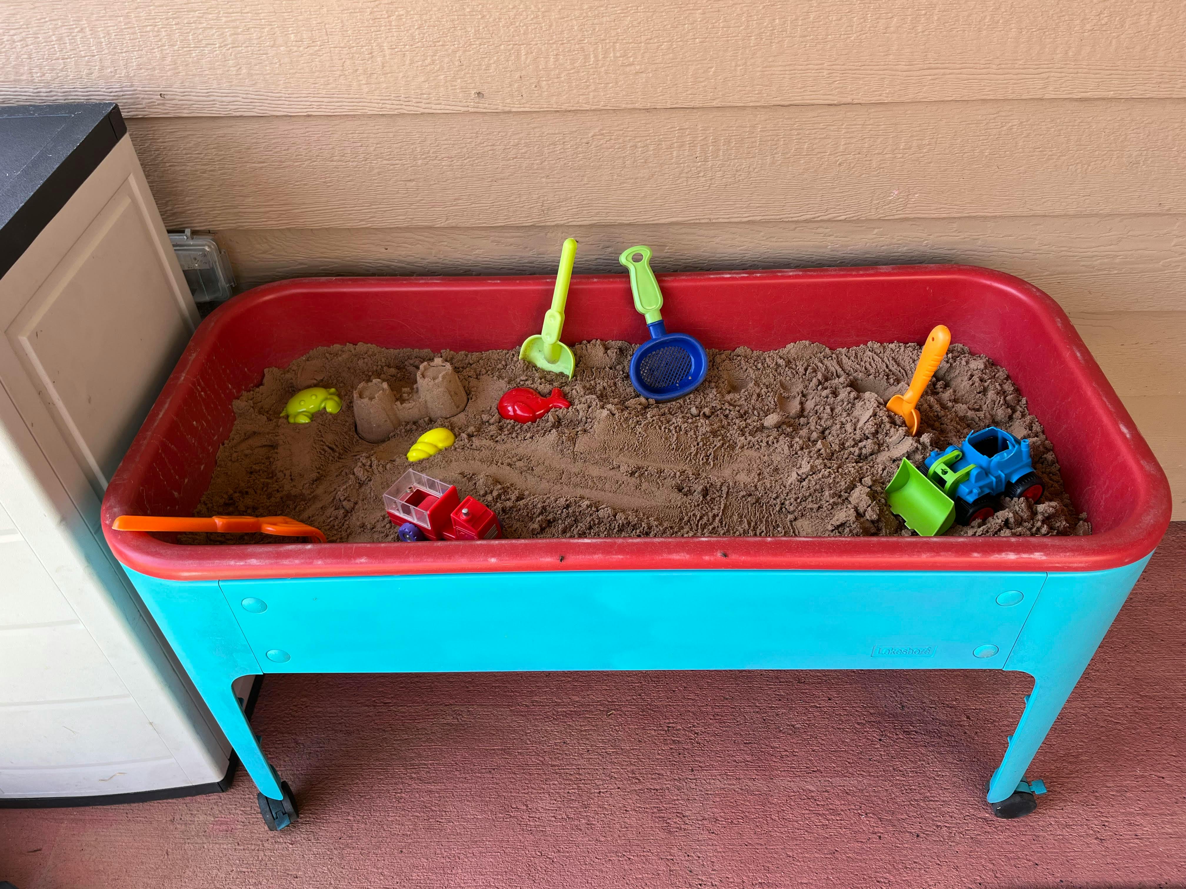 Sand table with sand toys