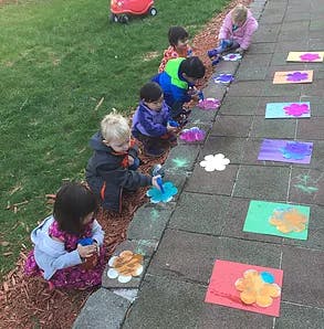 Children doing an art activity outdoors