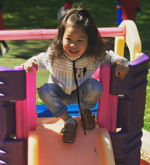 Child on a playground slide