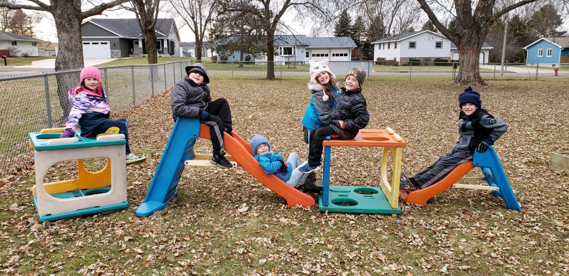 Children on playground equipment outdoors