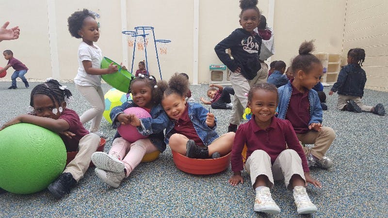 Children playing with balls and toys on the ground