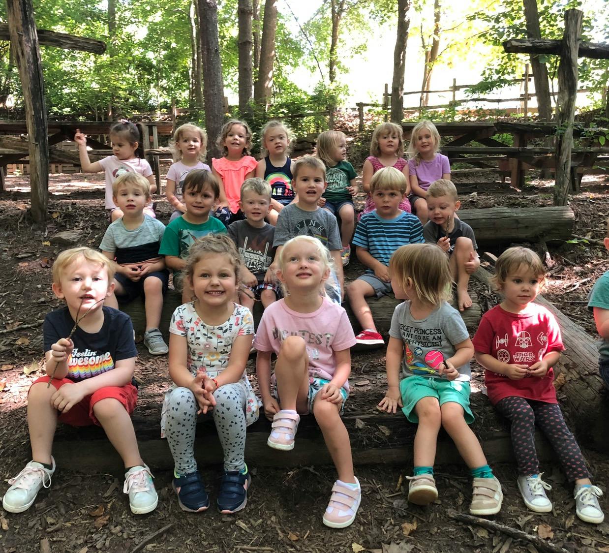 Group of children sitting outdoors
