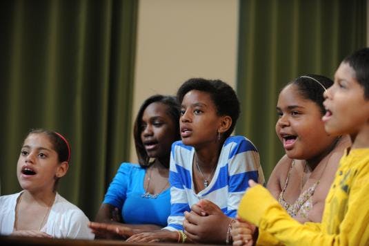 Group of children and teens singing