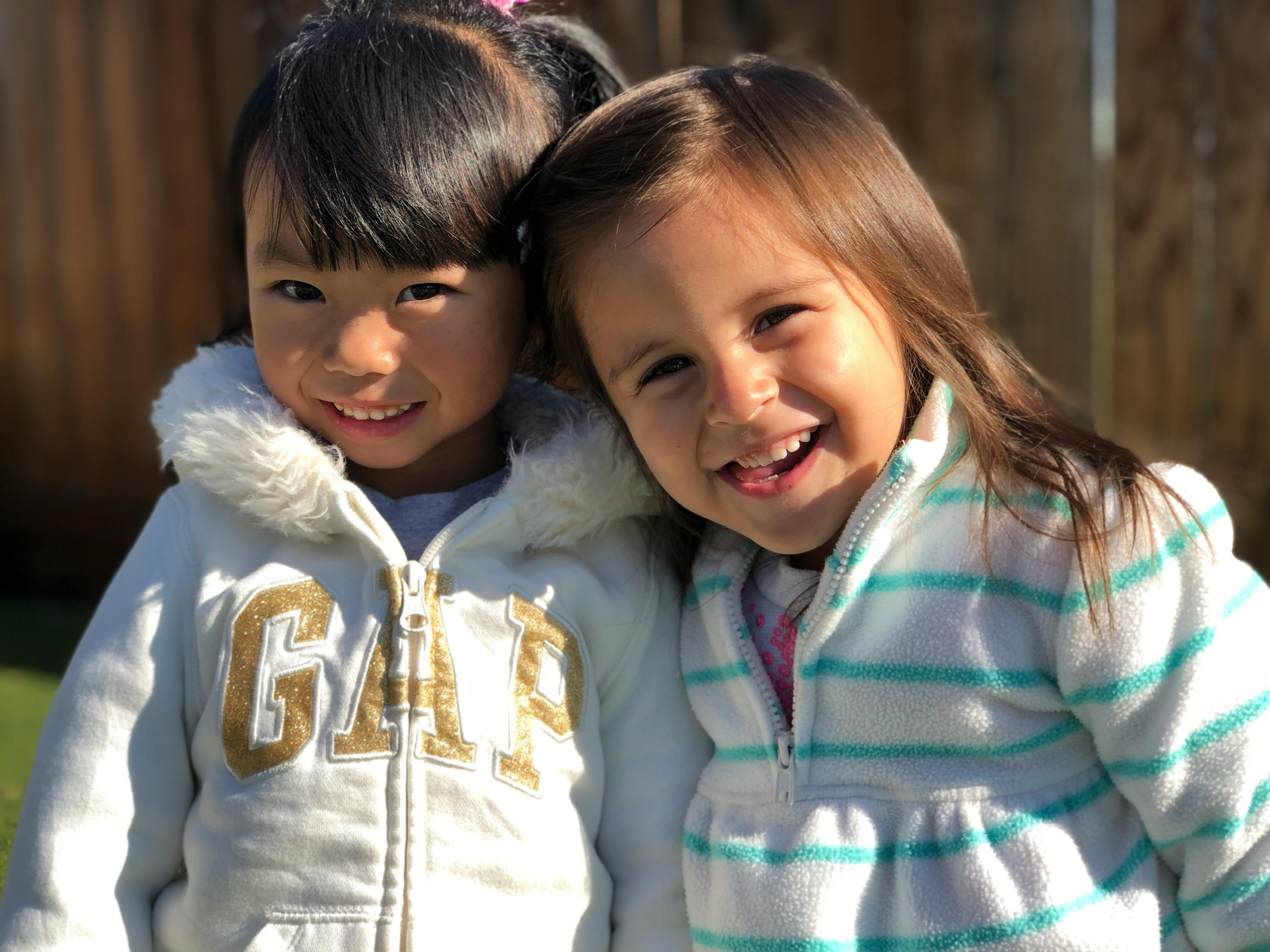 Two children smiling